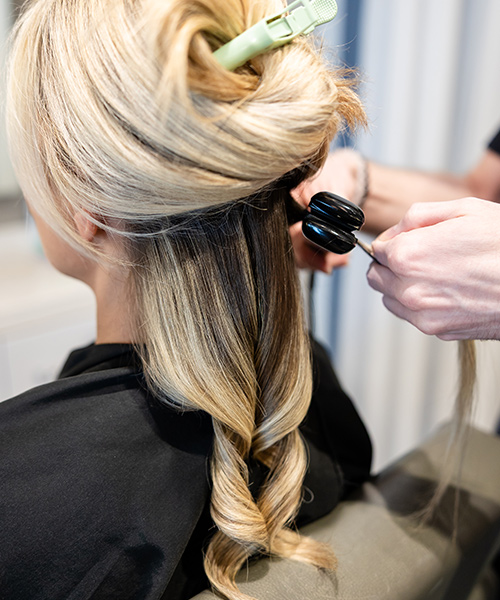 Blond hair girl with bouncy waves