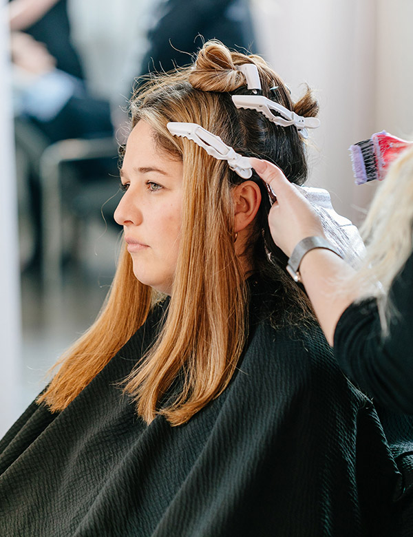 Brown haired girl getting her haired re colored